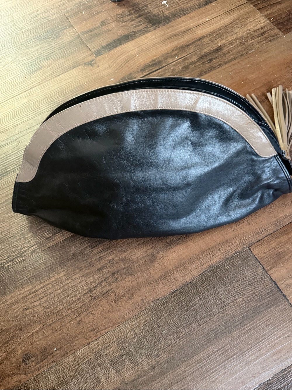 Slouchy Black Leather crescent clutch beige trim,curved zipper, tassel pull